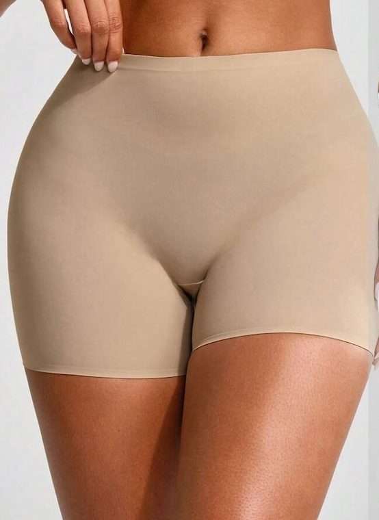 A woman wearing very tight "shapewear"; the photo is centered on her crotch. I'm sorry.